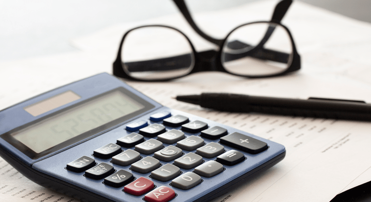 Calculator, pencil and glasses